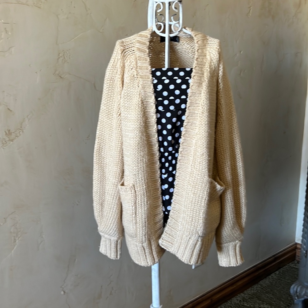 MinkPink cardigan with bell sleeves and pockets.